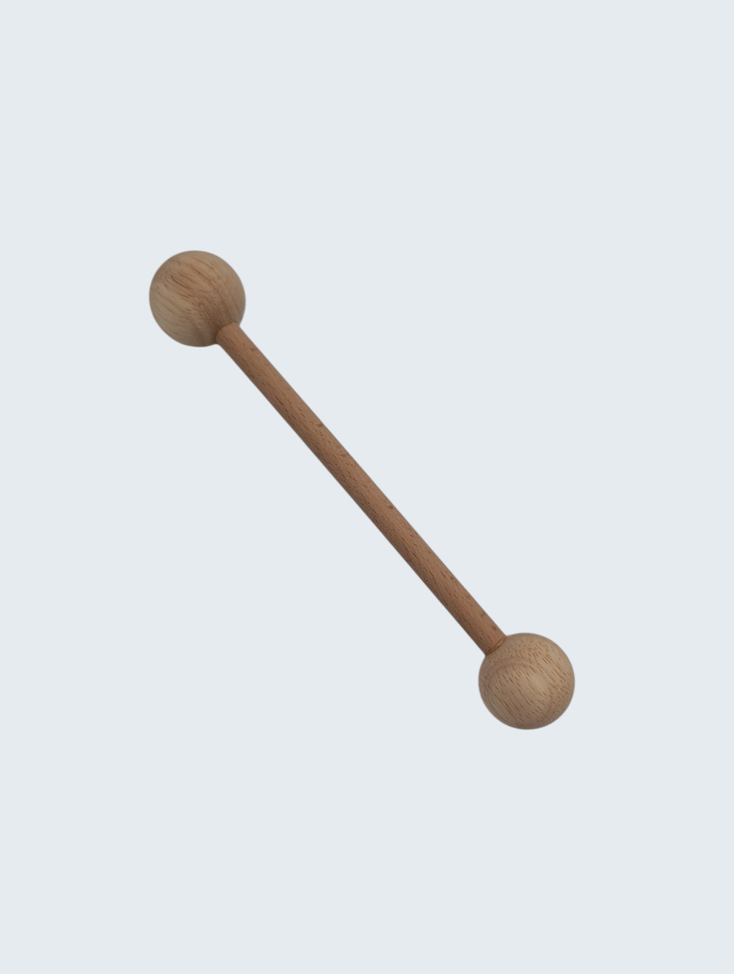 wooden double ended ball stylus on an off white background