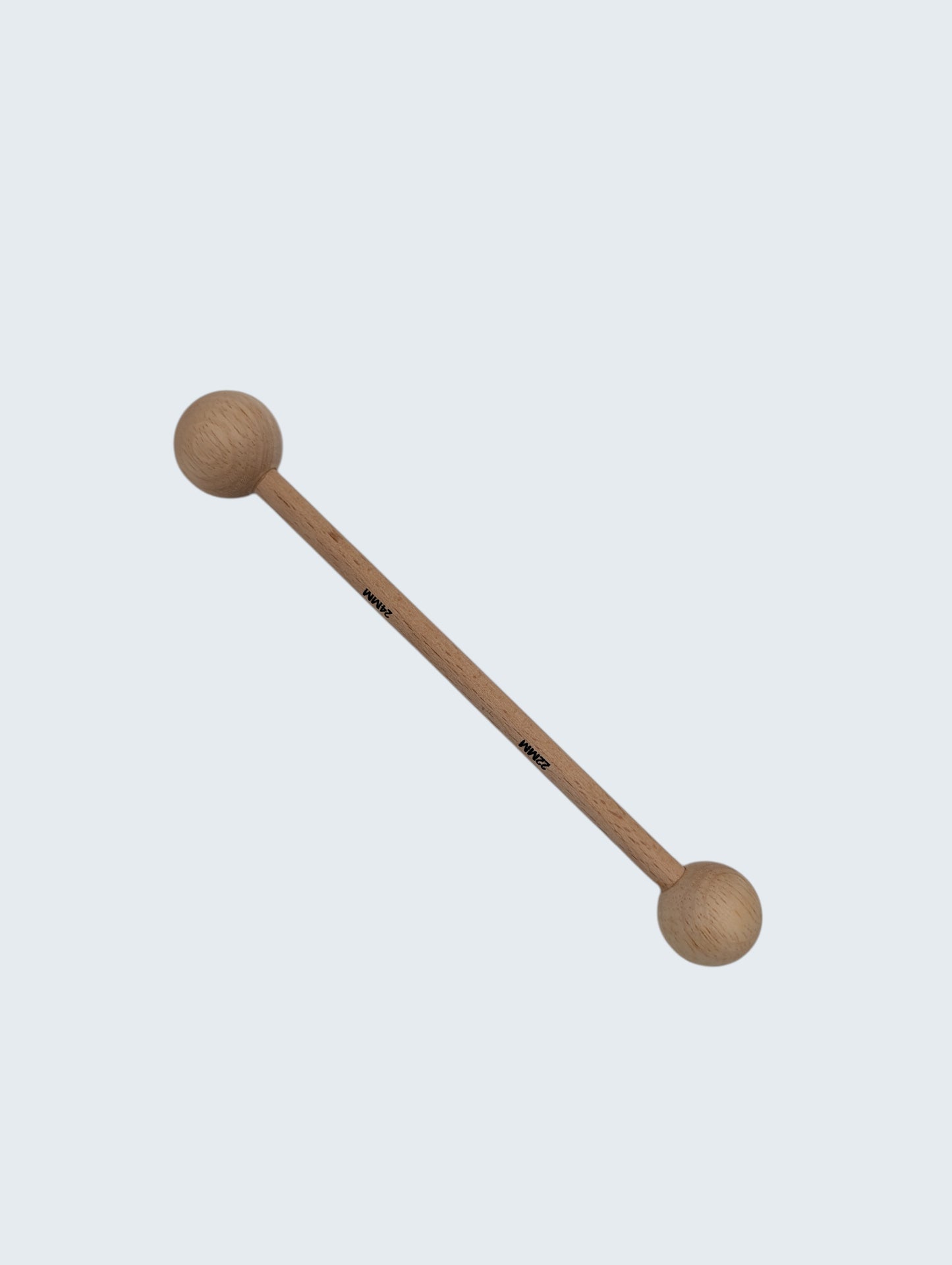 wooden double ended ball stylus on an off white background