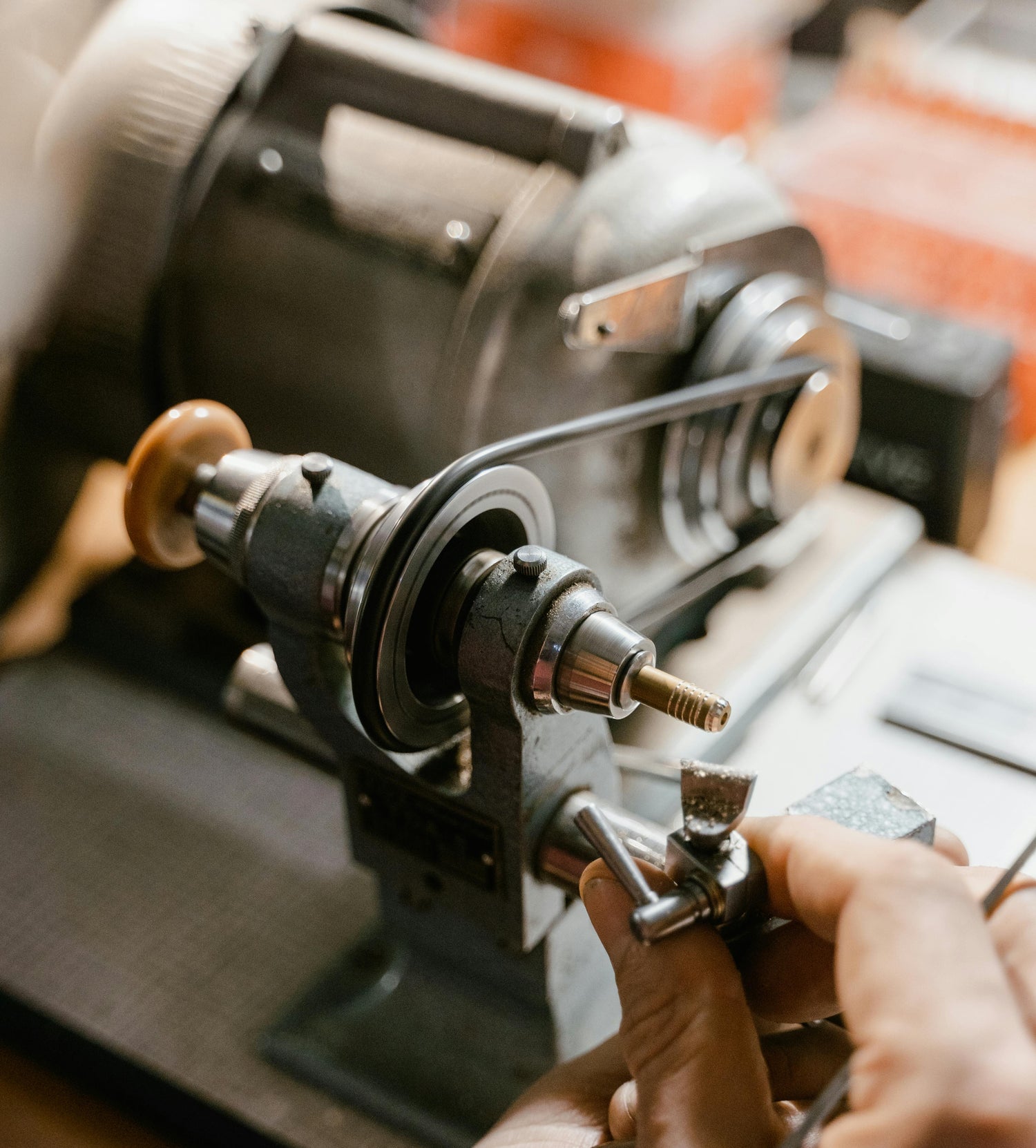 Person fixing a small belt driven motor
